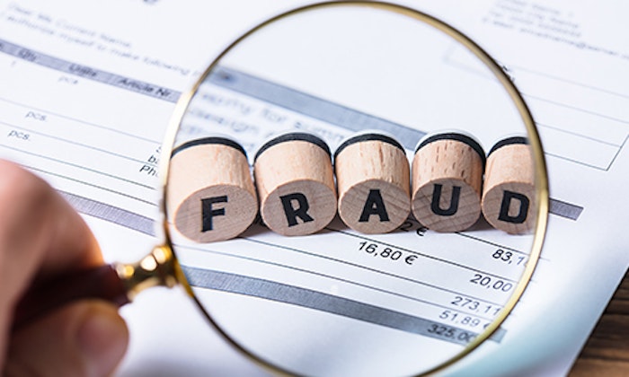 FRAUD in a magnifying glass